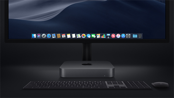 Mac mini photographed with a Magic Keyboard, Magic Mouse and display.