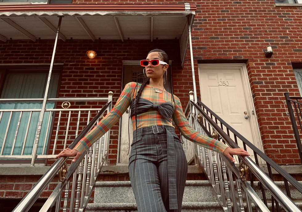 Shay poses on stairs.