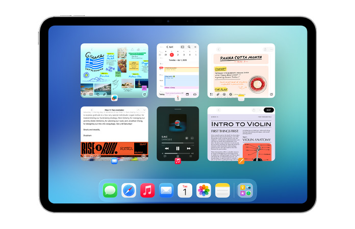 iPad, orientace na šířku, na obrazovce je šest oken ve dvou řadách včetně Kalendáře, Poznámek, Apple Hudby a Safari