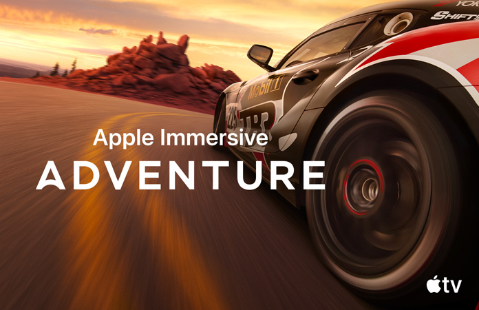 صورة لسيارة سباق مع جملة Apple Immersive Adventure بحروف بيضاء في الأعلى